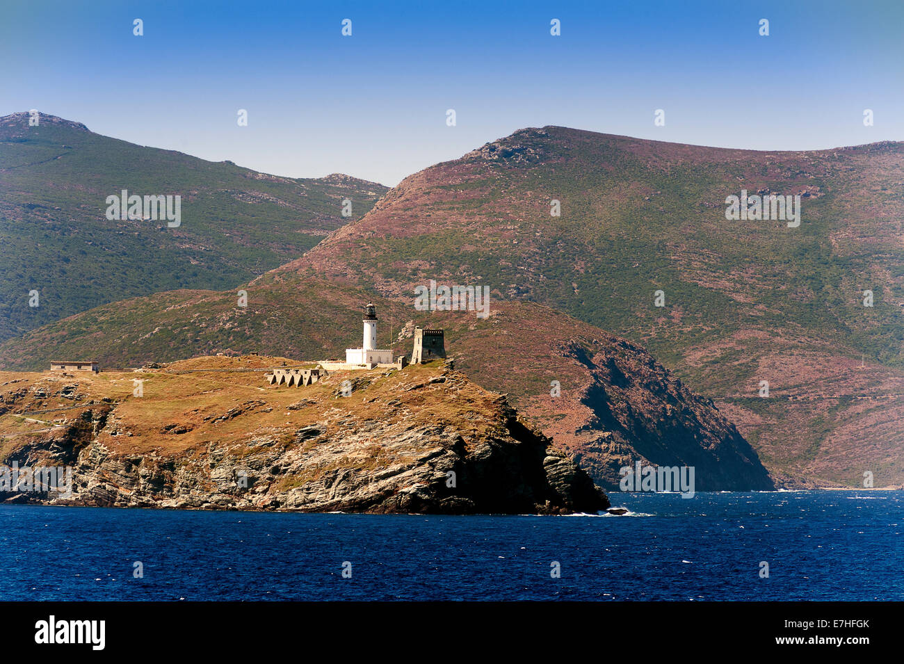 Europe, France, Haute-Corse, Cap Corse, Barcaggio. Giraglia island and its lighthouse. Stock Photo