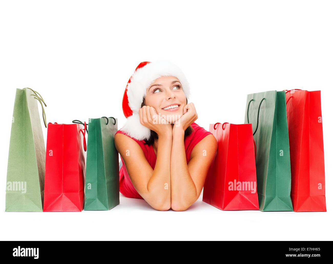 woman in red shirt with shopping bags Stock Photo
