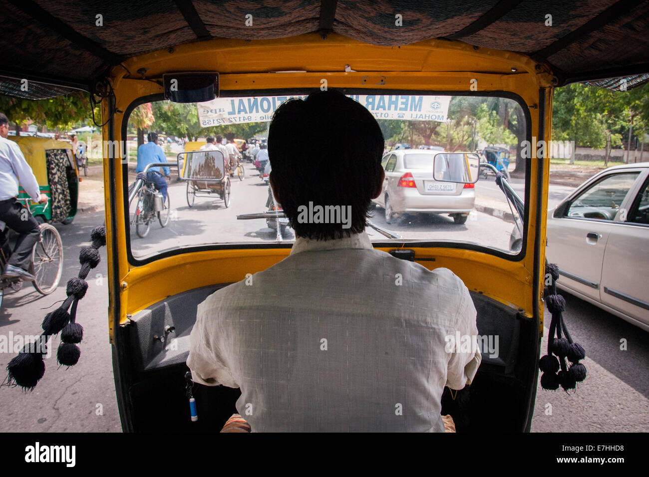 tuk tuk auto rickshaw taxi driver in Delhi India Stock Photo