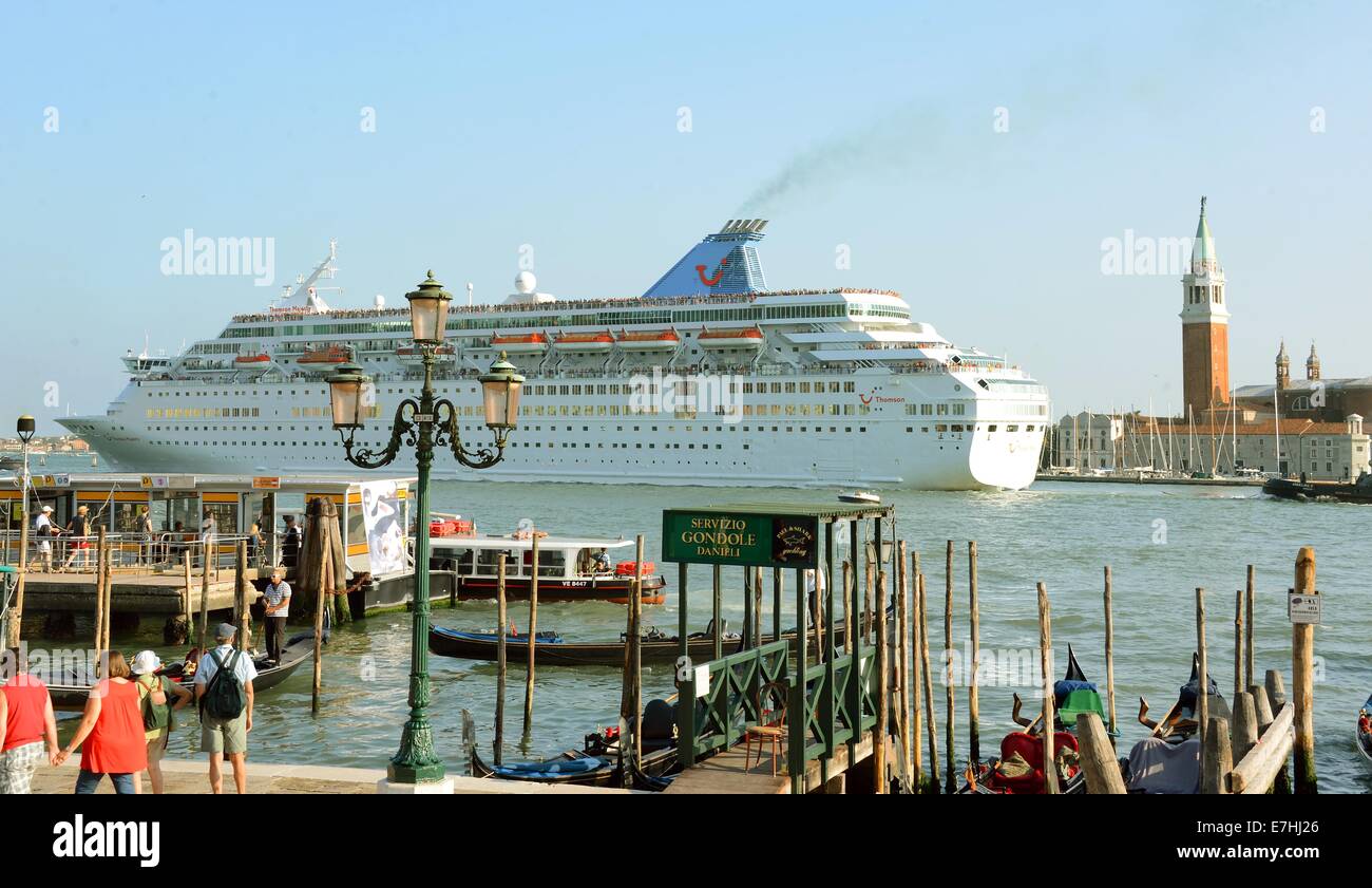 Venice, Germany. 08th Sep, 2014. The cruise ship Thomson Majesty leaves the harbour and passes close Piazza San Marco in Venice, Germany, 08 September 2014. A debate is currently going on about the passage of cruise ships this close to the city and the dangers for the environment this poses. The huge cruise ships are supposed to using the route close to Giudica in the future but rater the one closer to the train station, which is further from the city. Channels would have to be deepened and widened for this solution, however. Photo: Waltraud Grubitzsch -NO WIRE SERVICE-/dpa/Alamy Live News Stock Photo