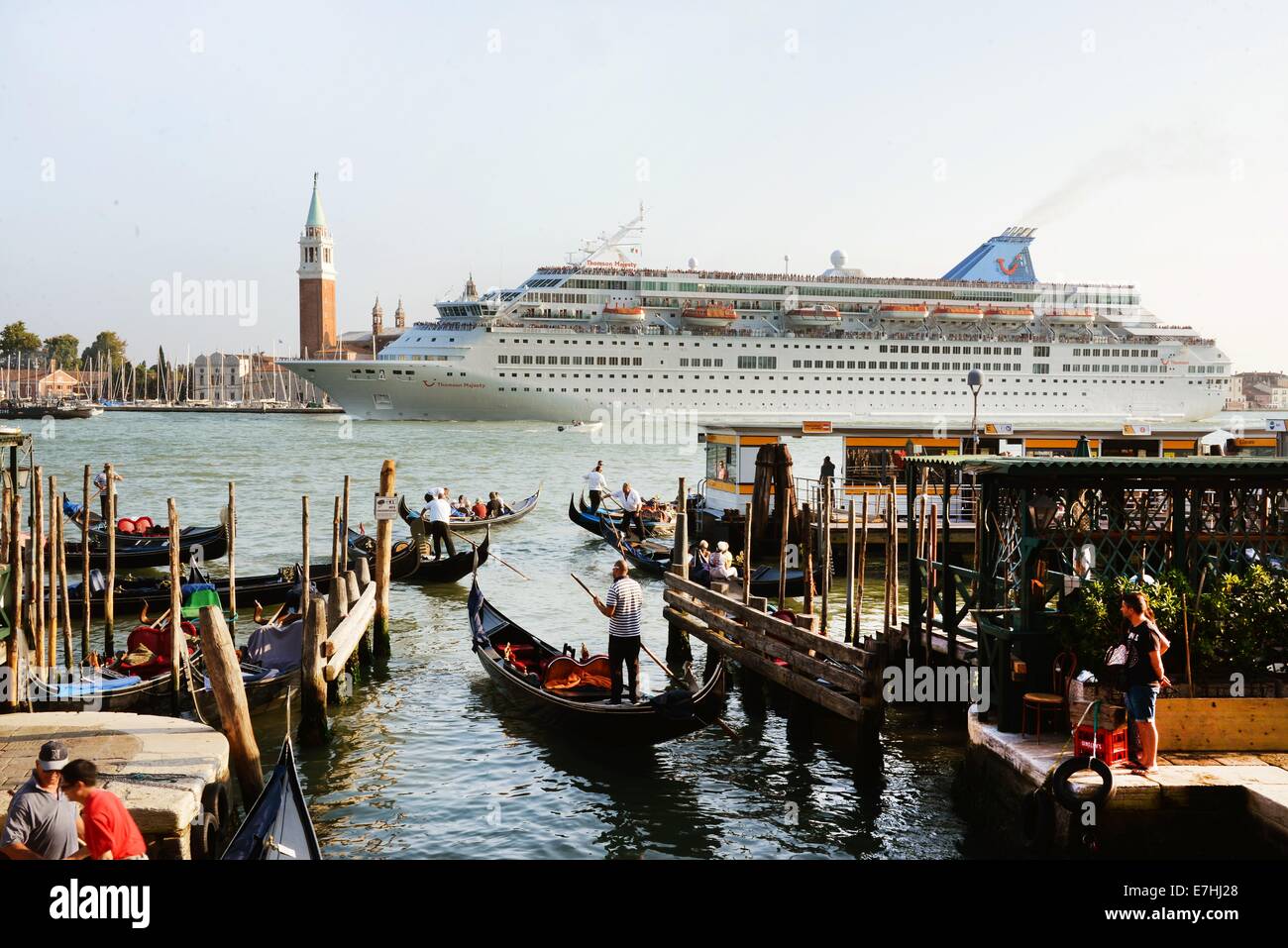 Venice, Germany. 08th Sep, 2014. The cruise ship Thomson Majesty leaves the harbour and passes close Piazza San Marco in Venice, Germany, 08 September 2014. A debate is currently going on about the passage of cruise ships this close to the city and the dangers for the environment this poses. The huge cruise ships are supposed to using the route close to Giudica in the future but rater the one closer to the train station, which is further from the city. Channels would have to be deepened and widened for this solution, however. Photo: Waltraud Grubitzsch -NO WIRE SERVICE-/dpa/Alamy Live News Stock Photo