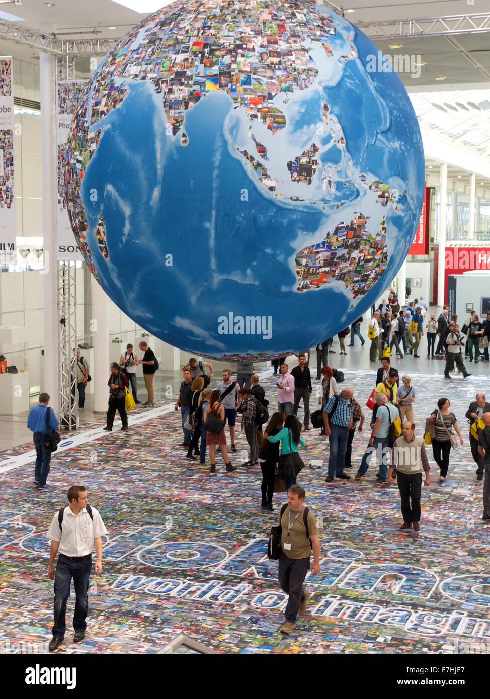 Photokina 2014 entrance with photo carpet and big globe made with pictures, and lots of visitors. Cologne, NRW, Germany Stock Photo