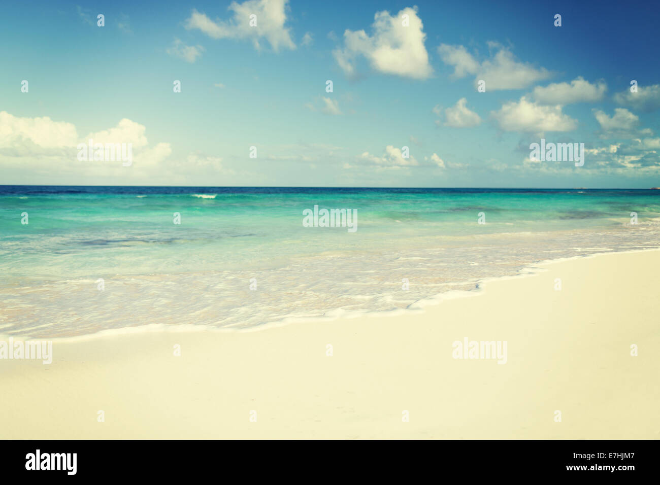 blue sea or ocean, white sand and sky with clouds Stock Photo - Alamy