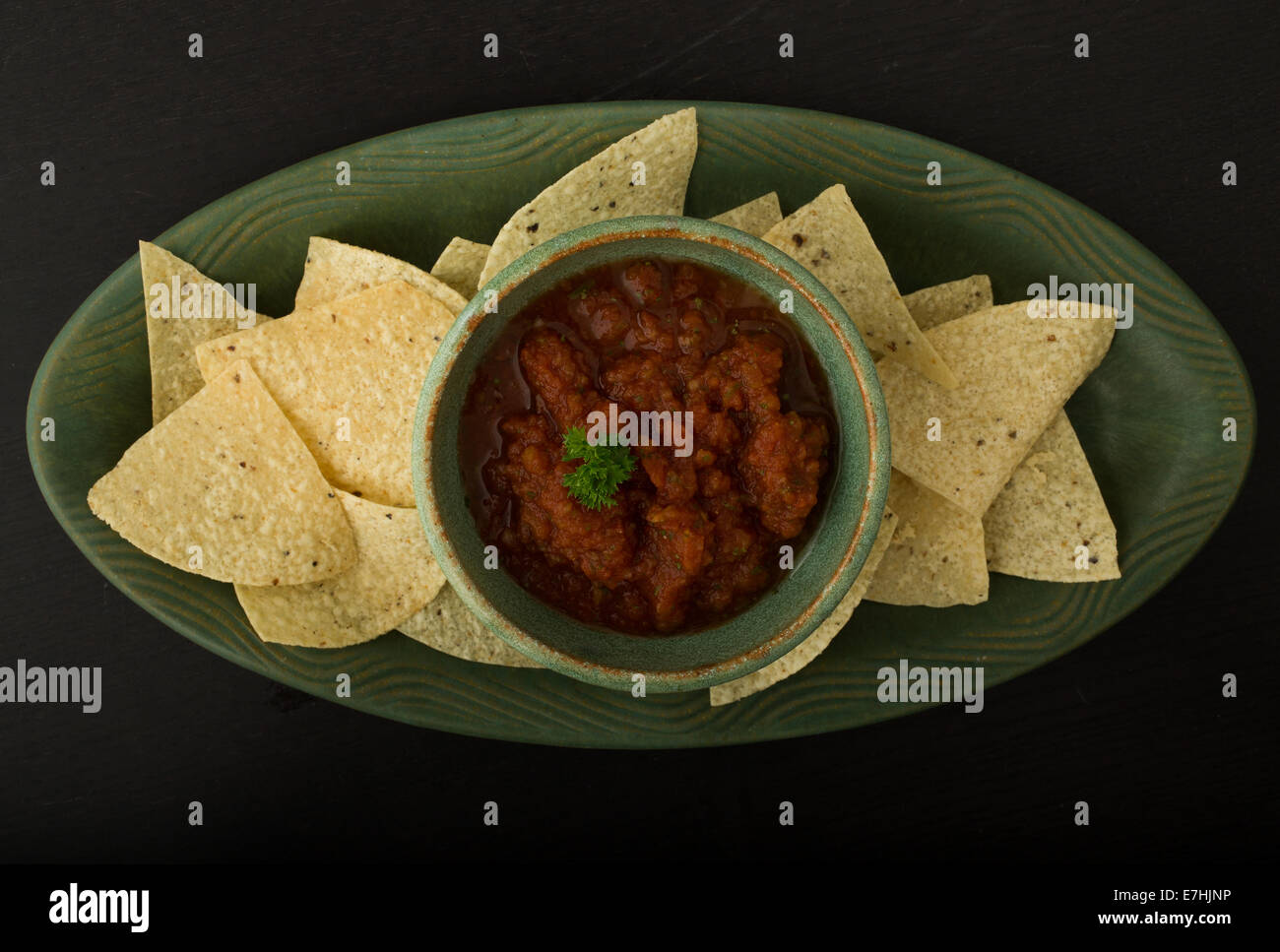 Tortilla white corn chips and fresh homemade tomato based salsa from above. Stock Photo