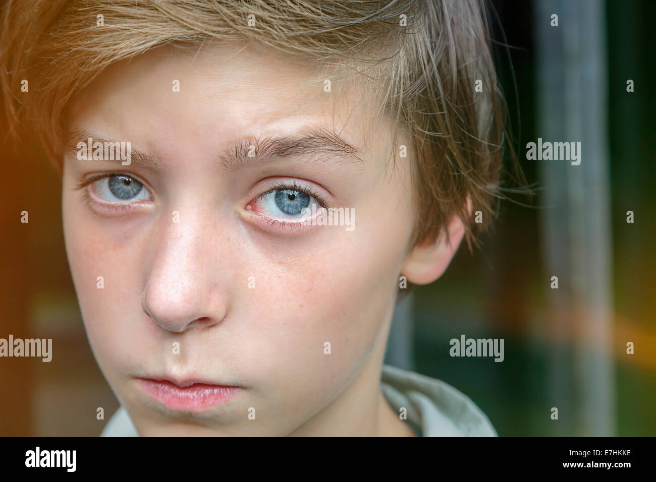 serious looking teenager boy in front of a metal grid Stock Photo Alamy serious looking teenager boy in front of a metal grid Stock Photo Alamy