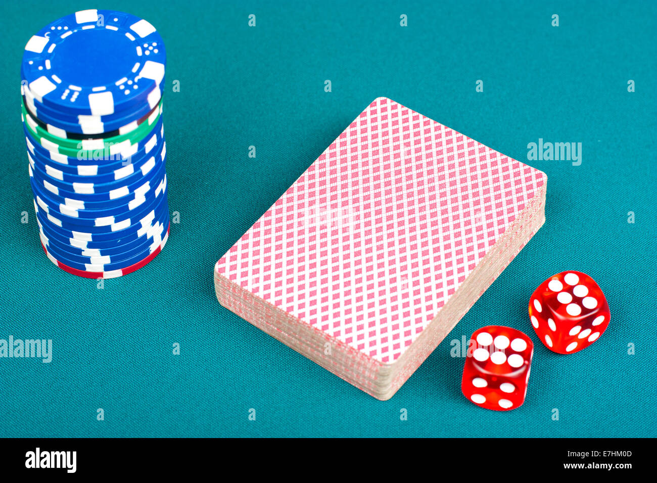 Cards, chips and dices for playing poker on the poker table Stock Photo
