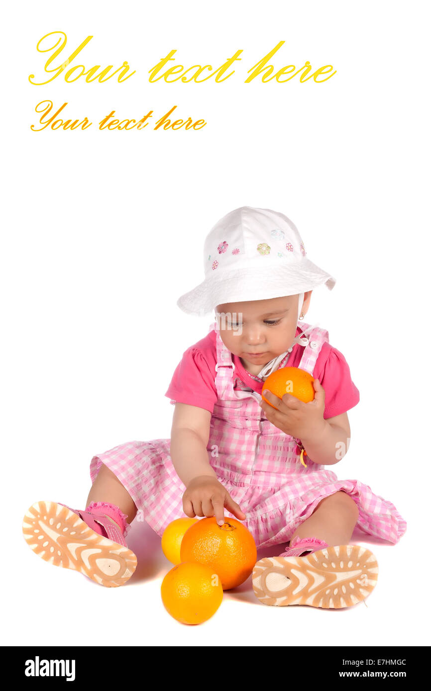 Girl playing with oranges and lemons in studio isolated over white background Stock Photo