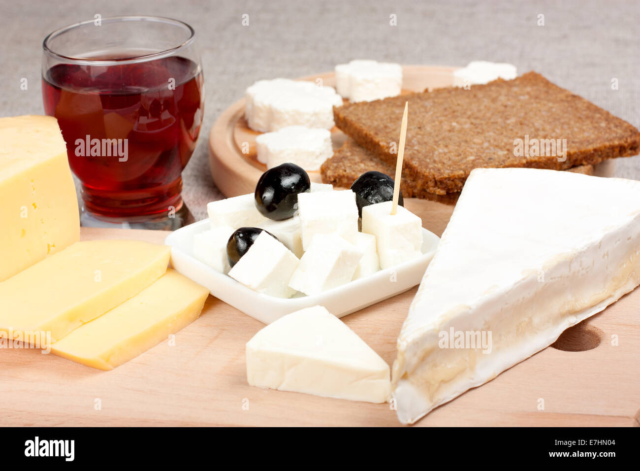 Different type of cheese and one glass of wine Stock Photo