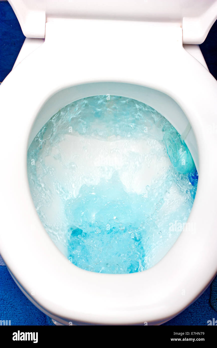 Toilet from above,drip drop bubble splash wasting water Stock Photo