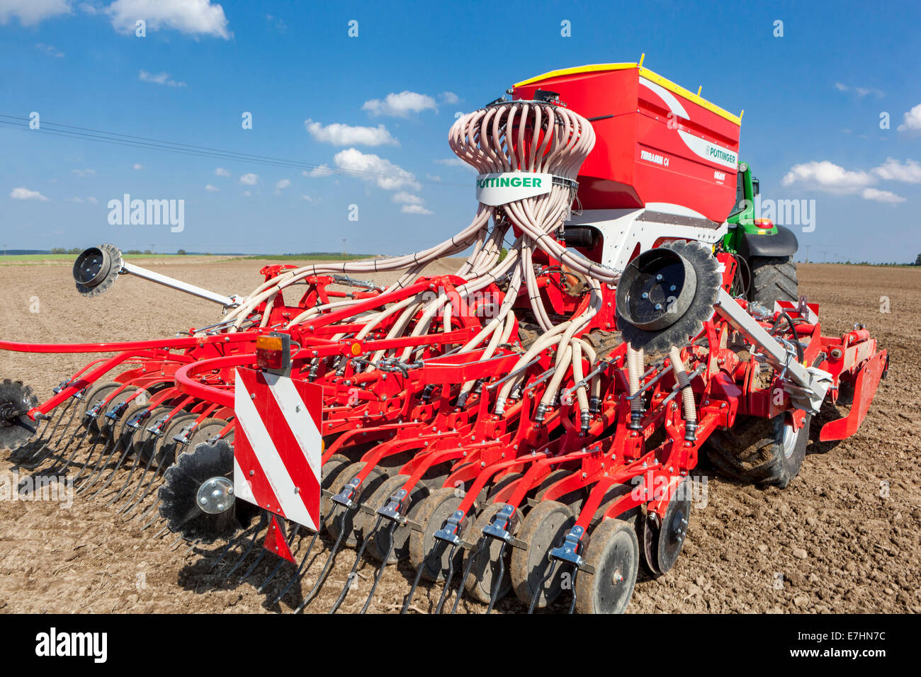 Sowing machine Seed Drill Pottinger sowing grain of wheat on a field Czech Republic farmer seeder hopper Stock Photo