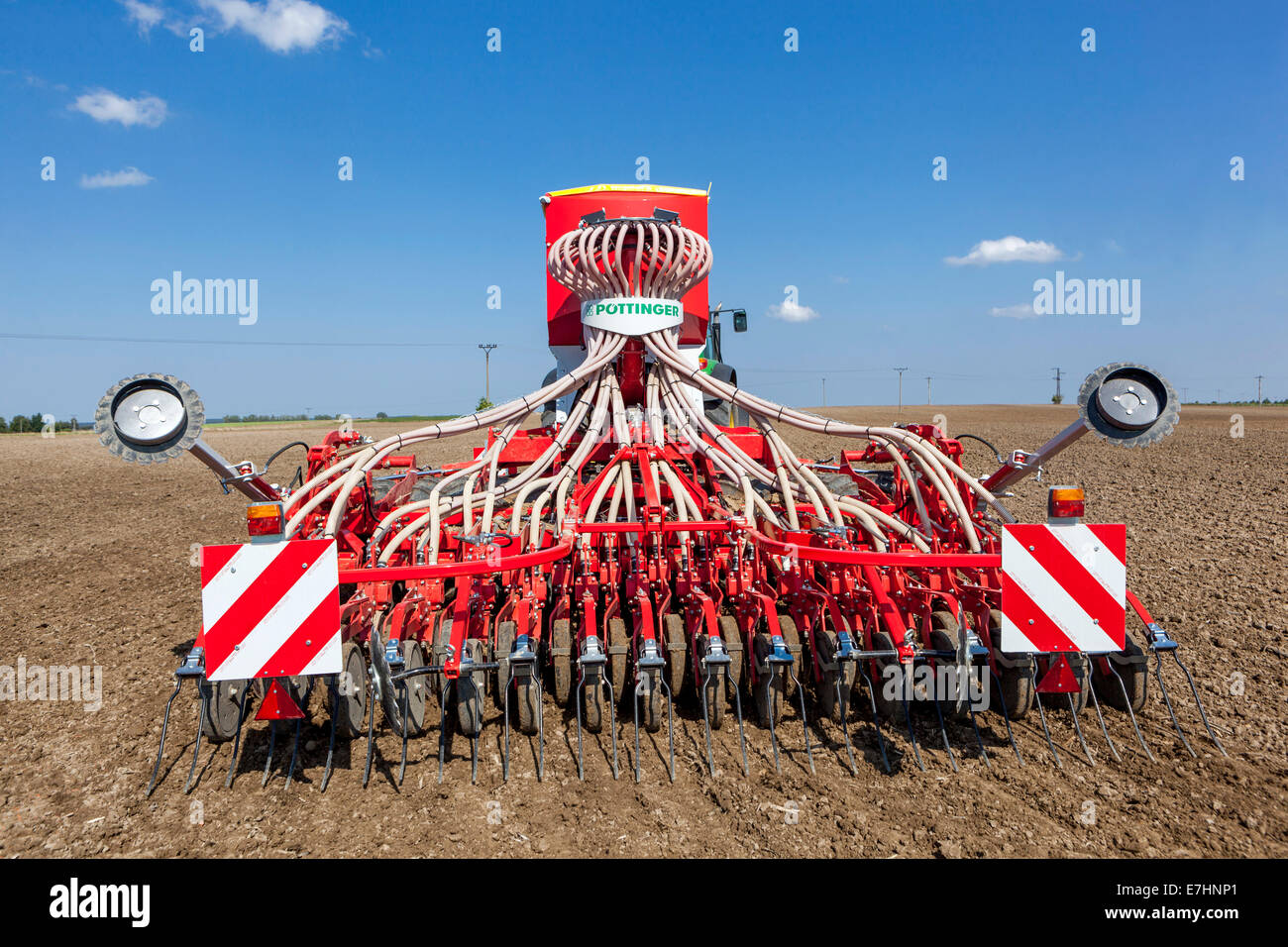 Seed Drill, sowing wheat on a field Czech Republic sowing machine Stock Photo