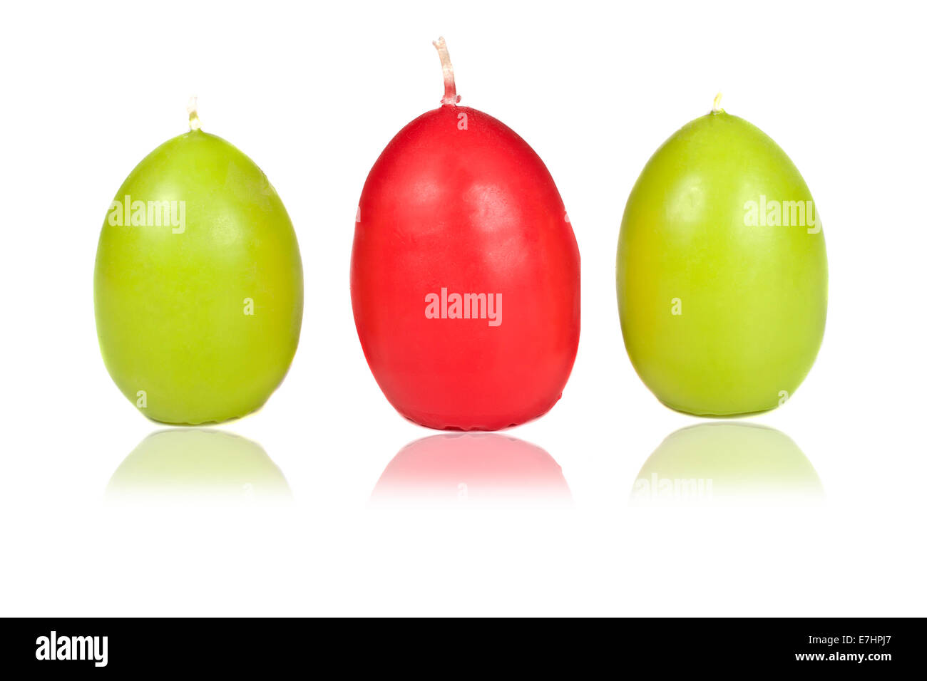 Easter candle in egg form on a white background Stock Photo