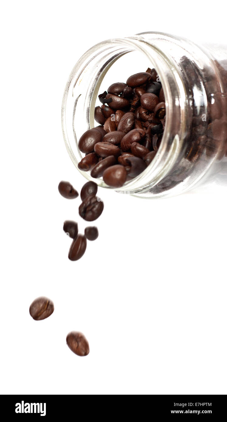 Coffee beans inside glass jar drop on white background Stock Photo