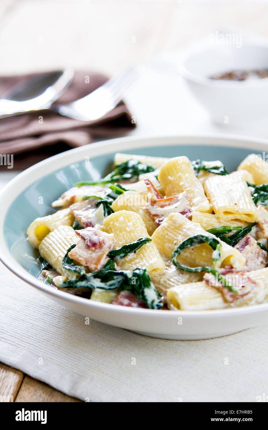 Rigatoni with Bacon and Spinach cream sauce Stock Photo