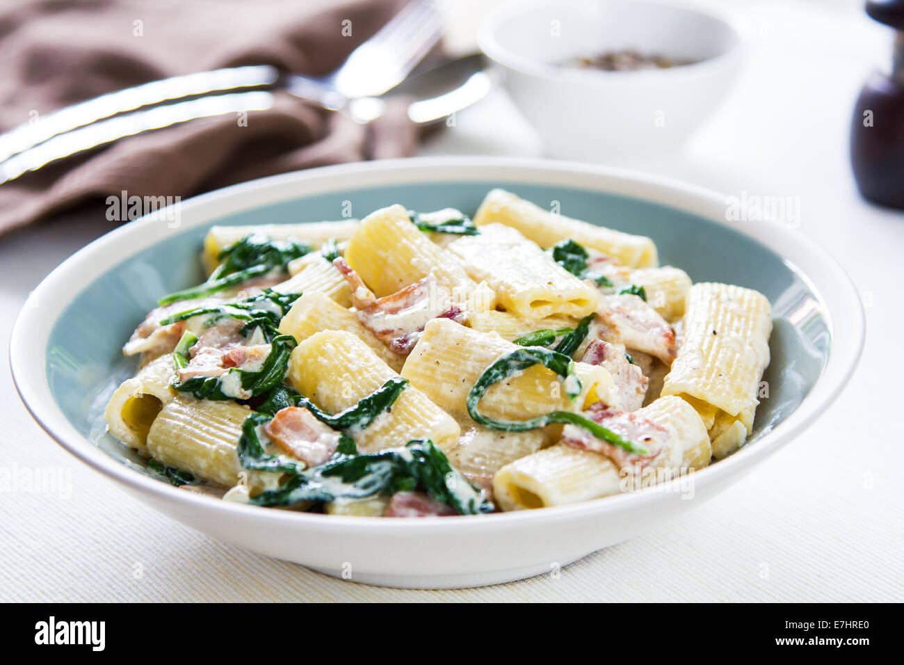 Rigatoni with Bacon and Spinach cream sauce Stock Photo