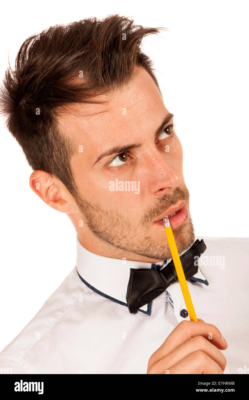 Closeup portrait of thoughtful young man with pencil isolated over white background Stock Photo