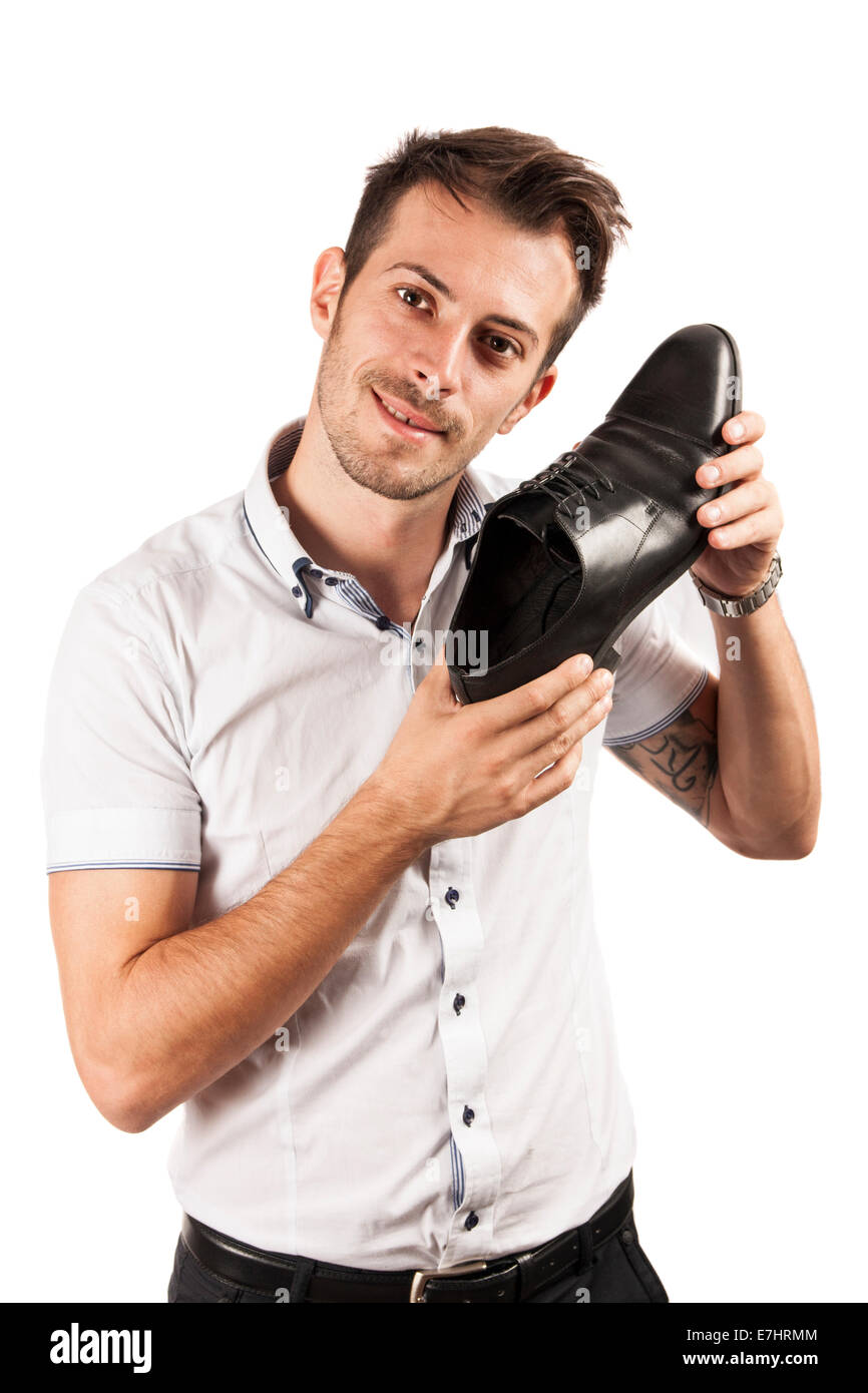Man showing one shoe isolated on white background Stock Photo