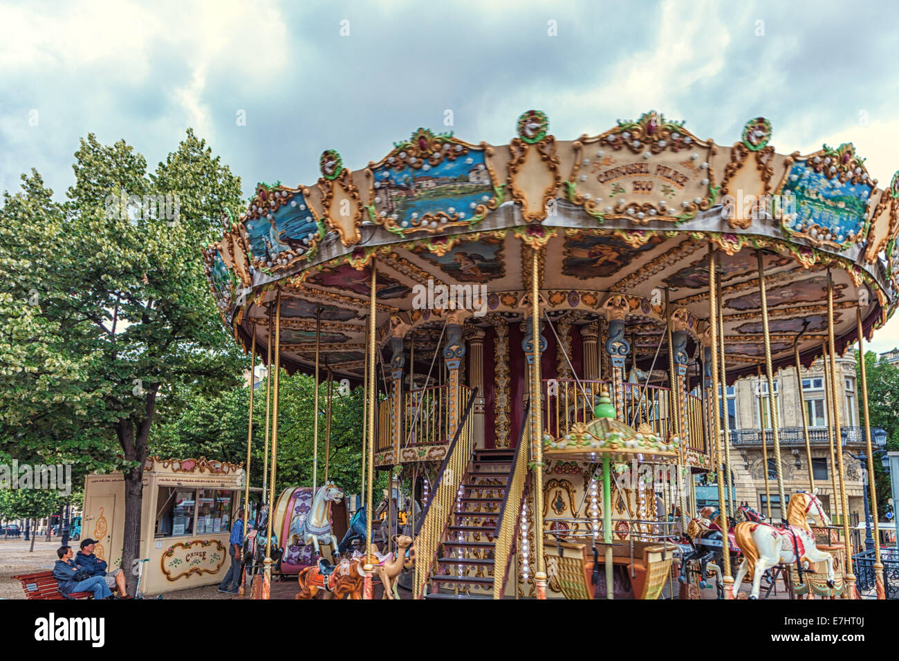 Ride the ponies and entertain the children on a beautiful antique double-decker carousel in the public square of Bordeaux France Stock Photo