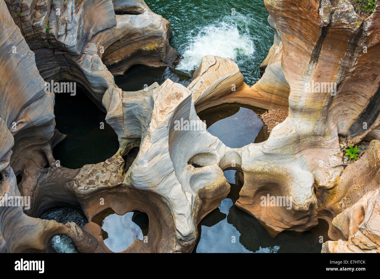 Potholes and plunge pools of the Treur River at Bourke's Luck Stock ...