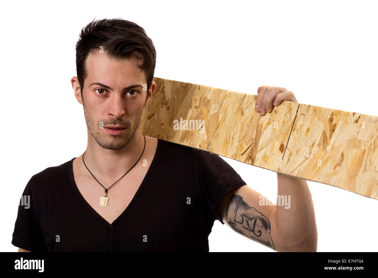 Young man with wood board on his shoulder on white background Stock Photo