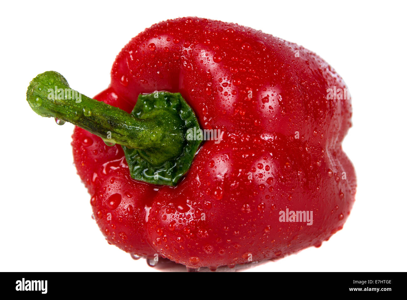 Pepper in spray of water on white background Stock Photo