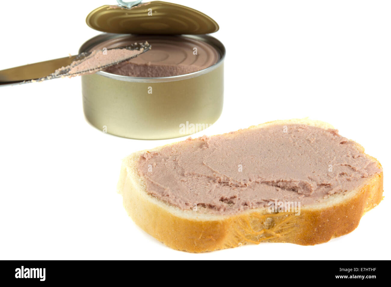 Sandwich with canned pork pate over white background Stock Photo