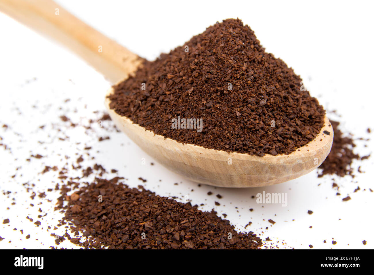 wooden spoon with ground coffee over white background Stock Photo - Alamy