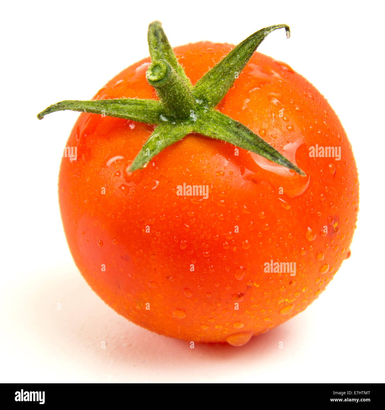 Close up of a fresh tomato on white background Stock Photo