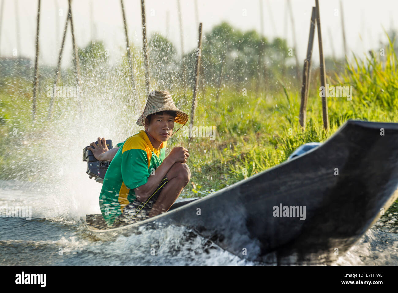 Myanmar (Burma), Shan State, Inle Lake, Man in Motorised Longtail Boat Stock Photo