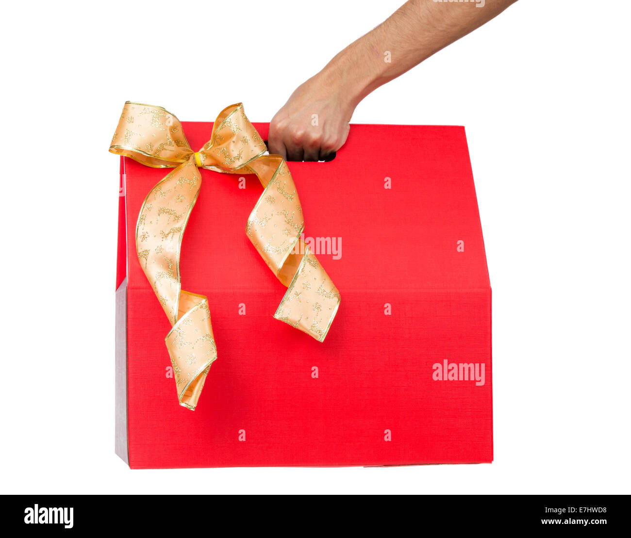 Male hand holding red gift box with a bow isolated Stock Photo