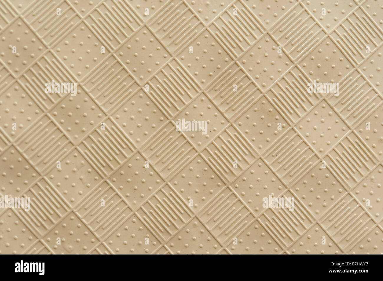 rubber mat texture of raised squares with alternating lines and dots Stock Photo