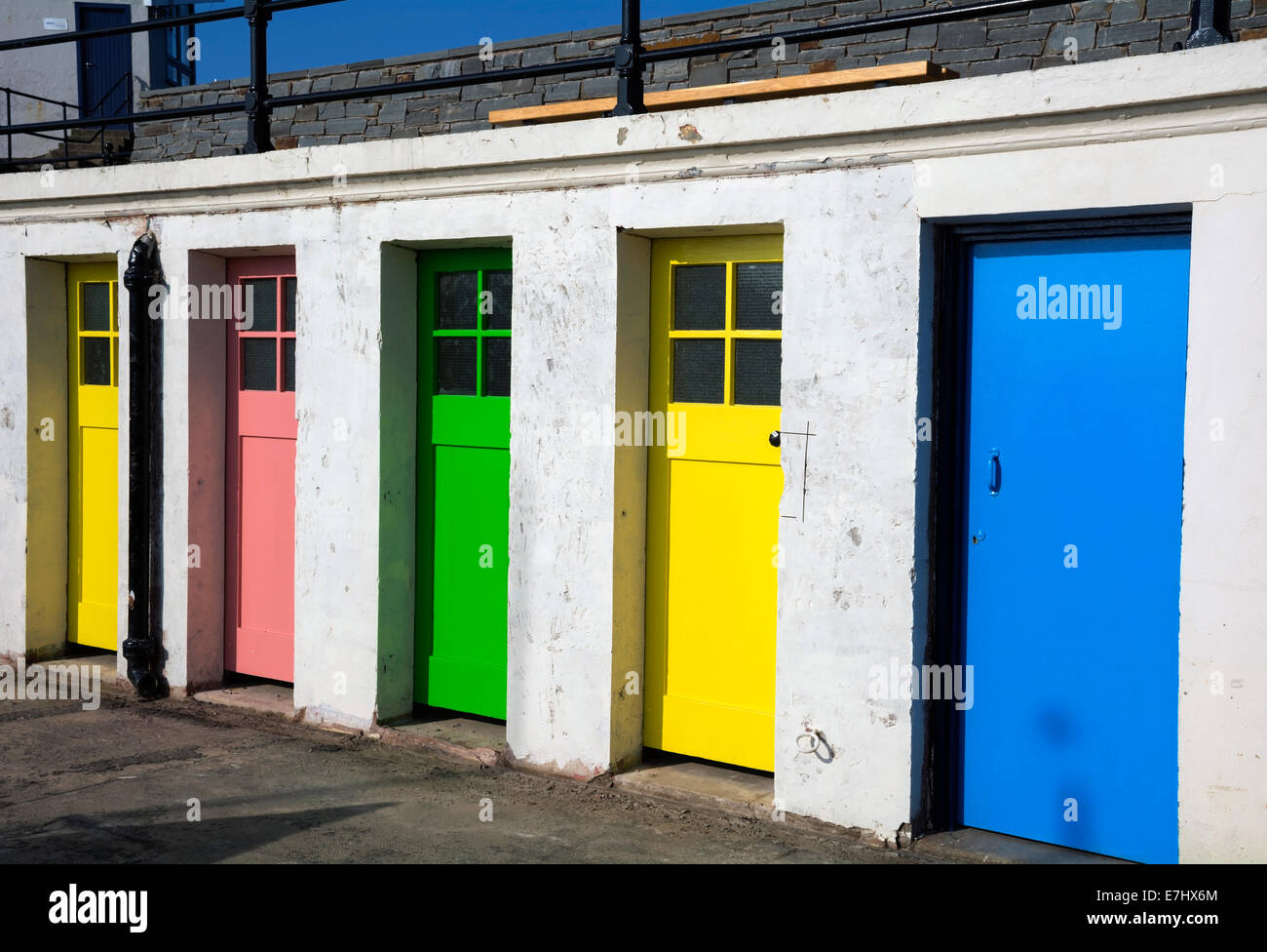 Colourful doors to former outdoor swimming pool changing rooms near the harbour at North Berwick. Stock Photo