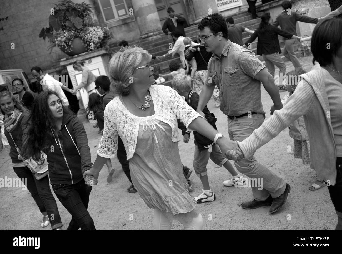 Dancing in the market square, Pont-l'Eveque, Normandy, France Stock Photo