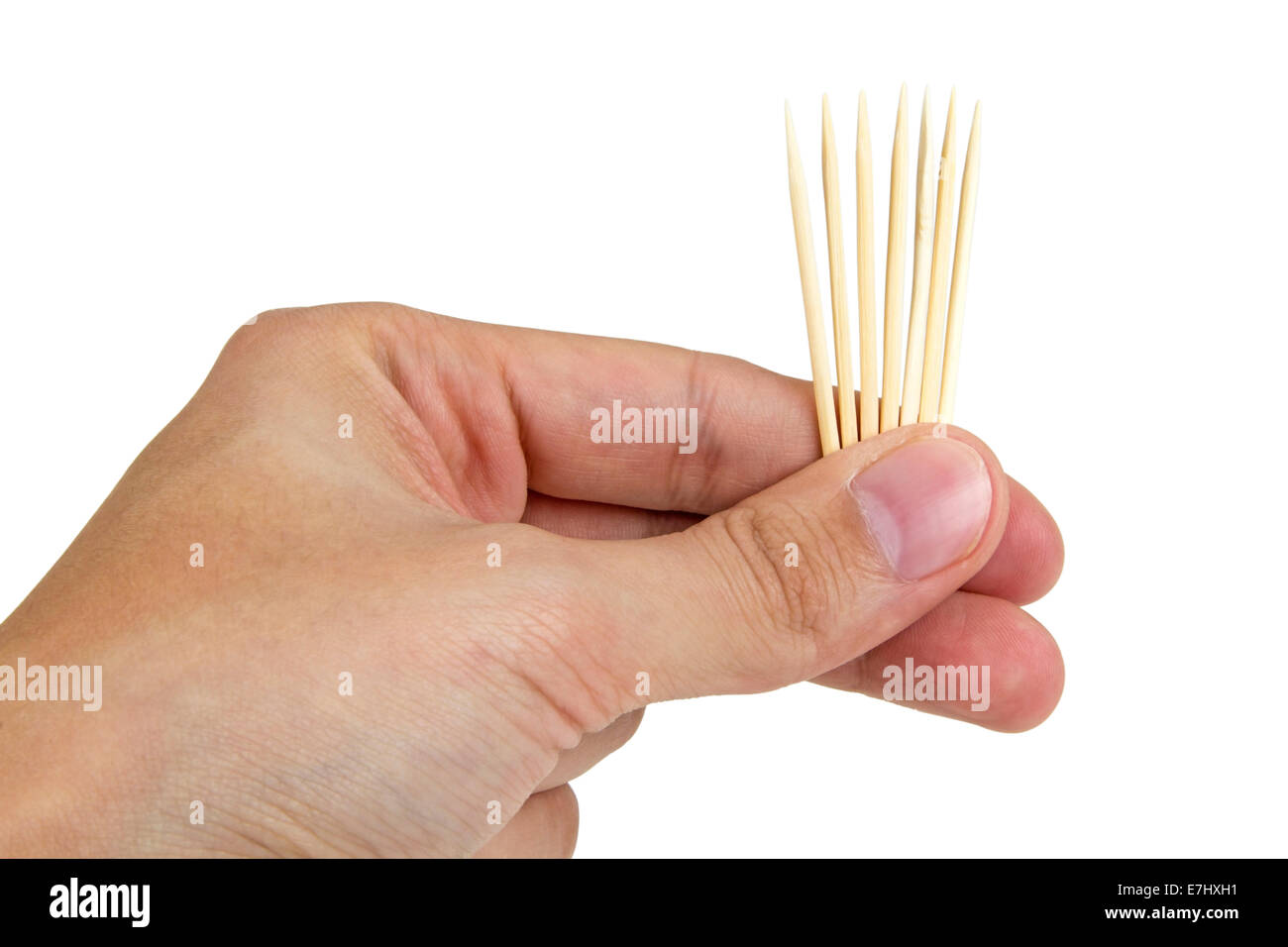 Toothpicks in hand isolated on white with clipping path Stock Photo