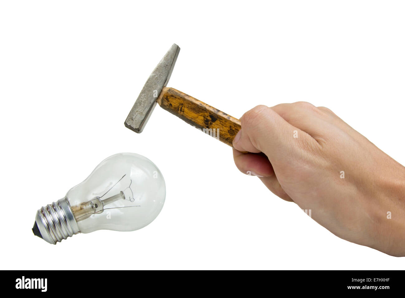 hammer breaking electric bulb isolated over white background Stock Photo