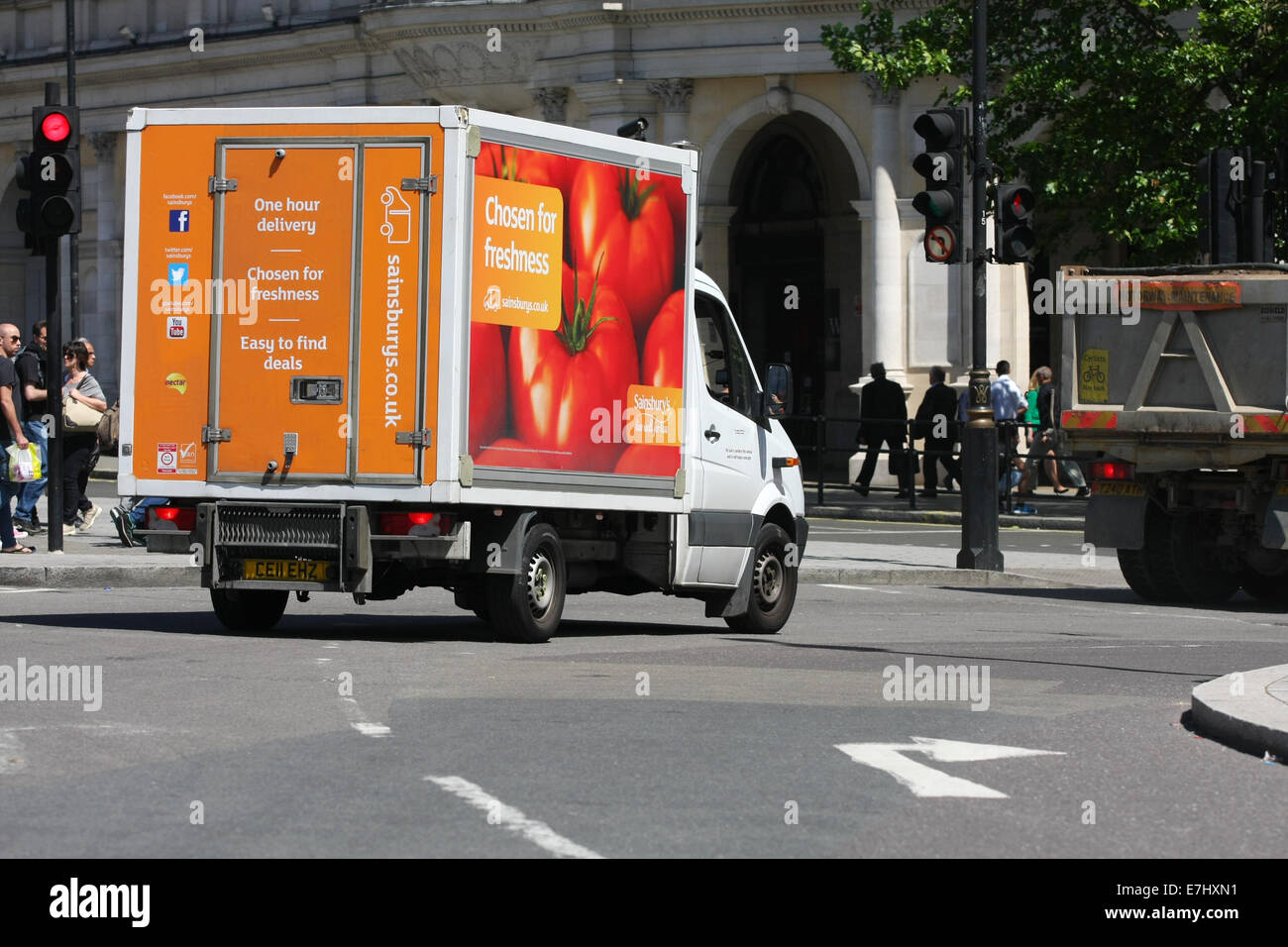 Rear view of a Sainsbury's truck traveling along a road in London Stock ...