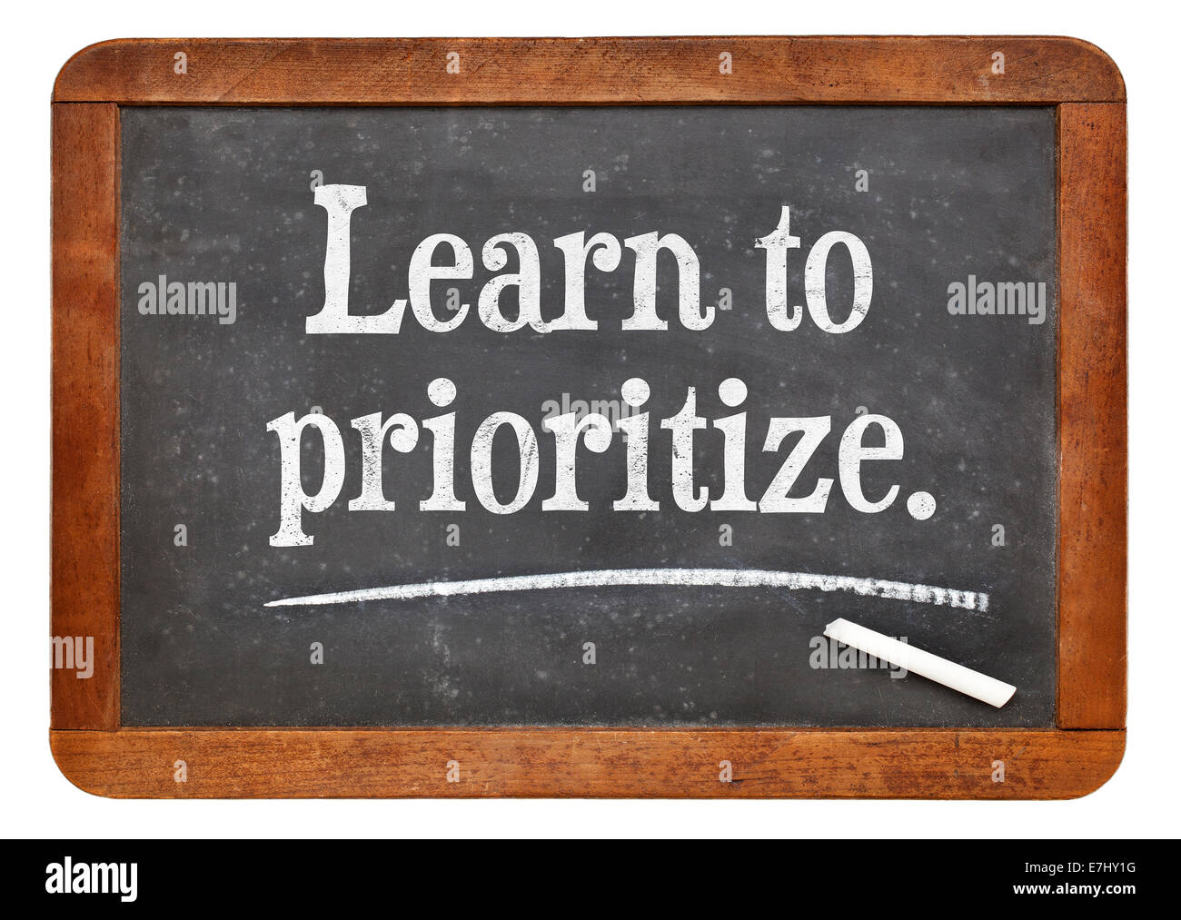 learn to prioritize - motivational advice on a vintage slate blackboard Stock Photo