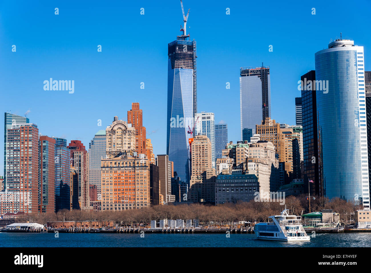 US, New York City. Lower Manhattan seen from the Staten Island ferry. One World Trade Center (Freedom Tower) Under Construction. Stock Photo