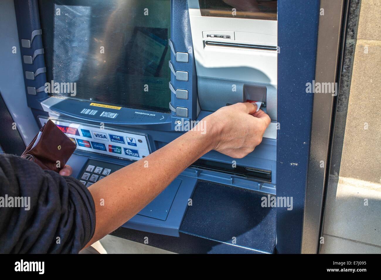 A women using a Barclays ATM cash machine in Alnwick Northumberland UK Stock Photo