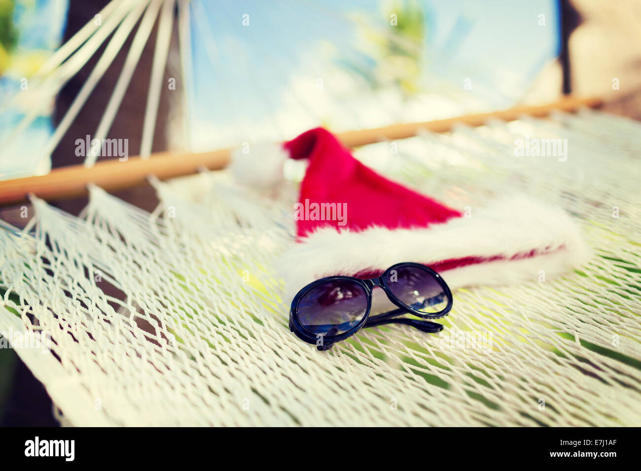 hammock with santa helper hat and shades Stock Photo - Alamy
