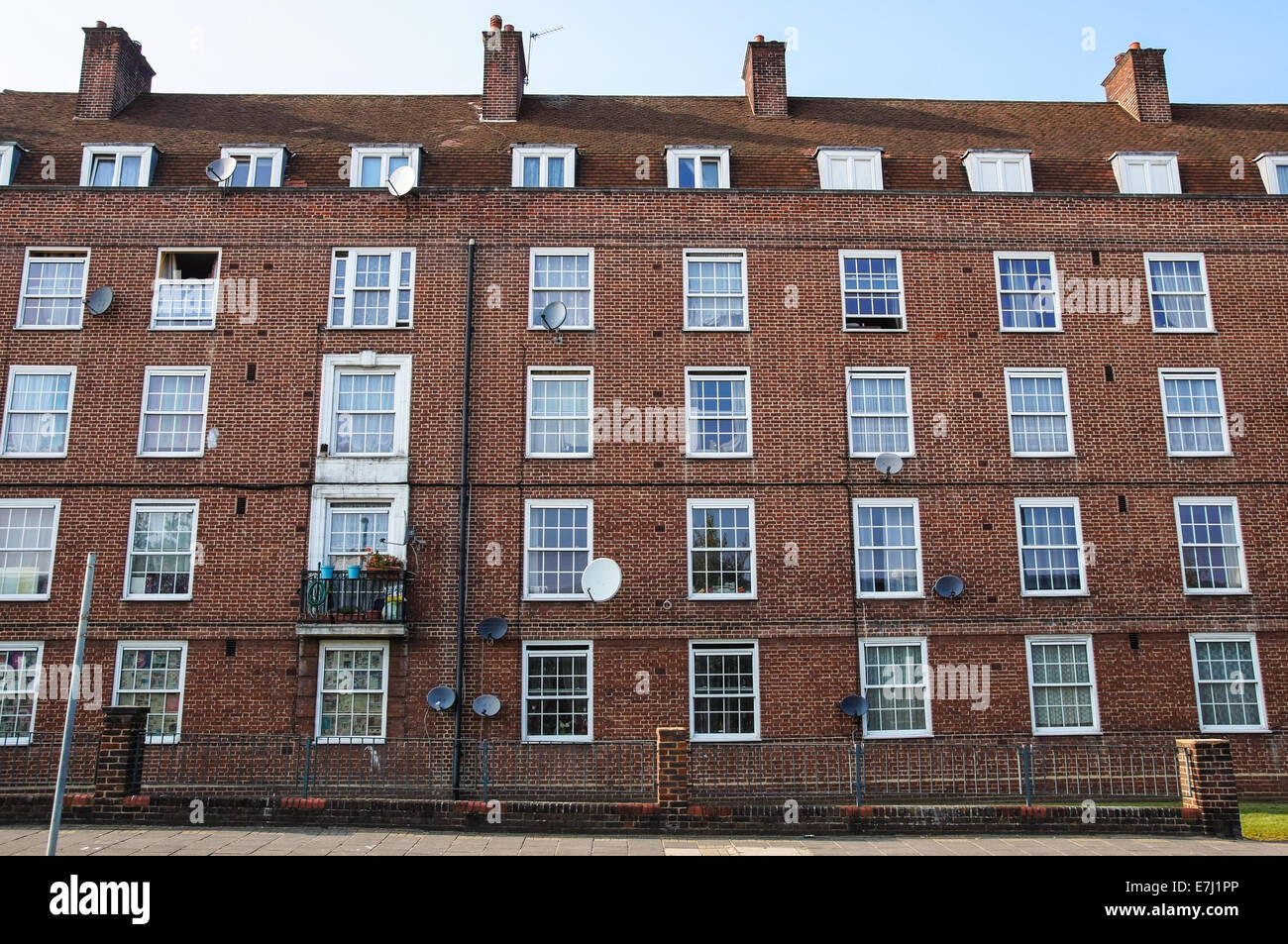 A Row of Brick Buildings with Black Doors on a Street in London Stock Image  - Image of architecture, english: 189002149