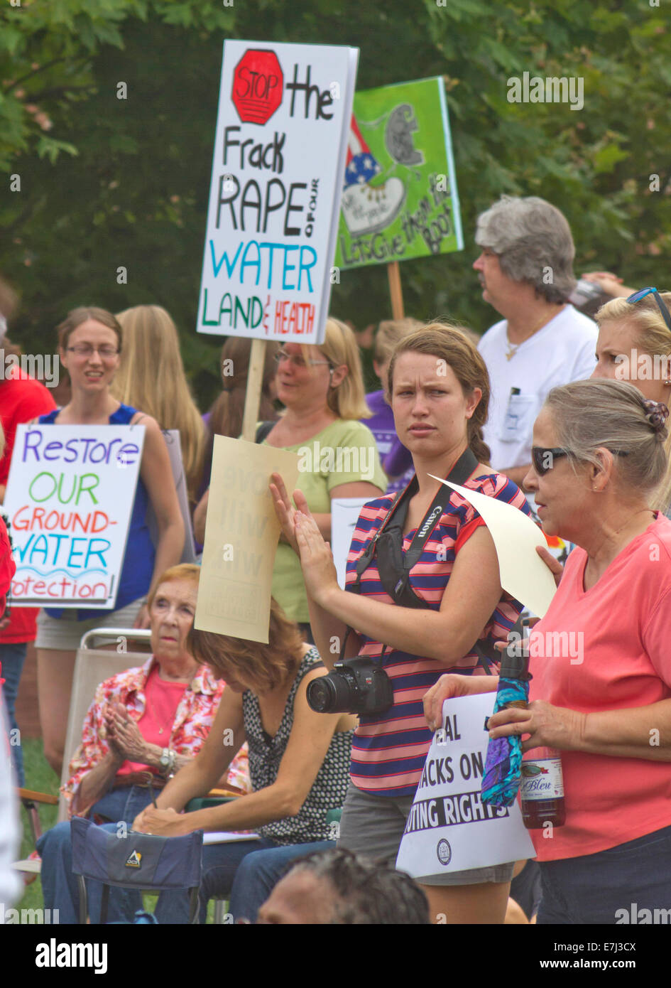 Fracking protesters hold signs at a Moral Monday rally in Asheville, NC Stock Photo
