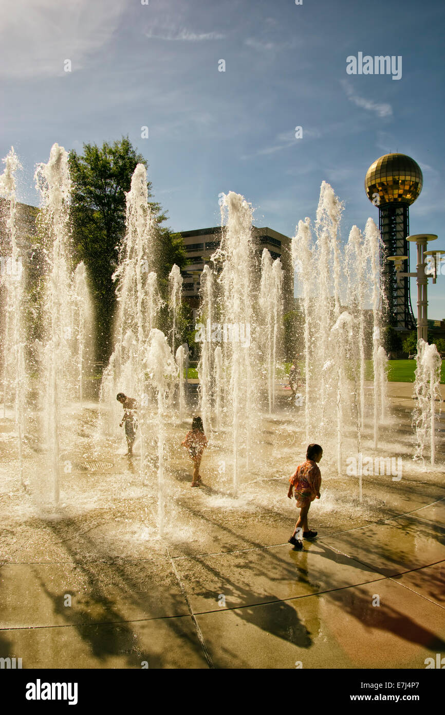A bunch of kids play in a fountain at Worlds Fair Park in Knoxville, TN. Stock Photo