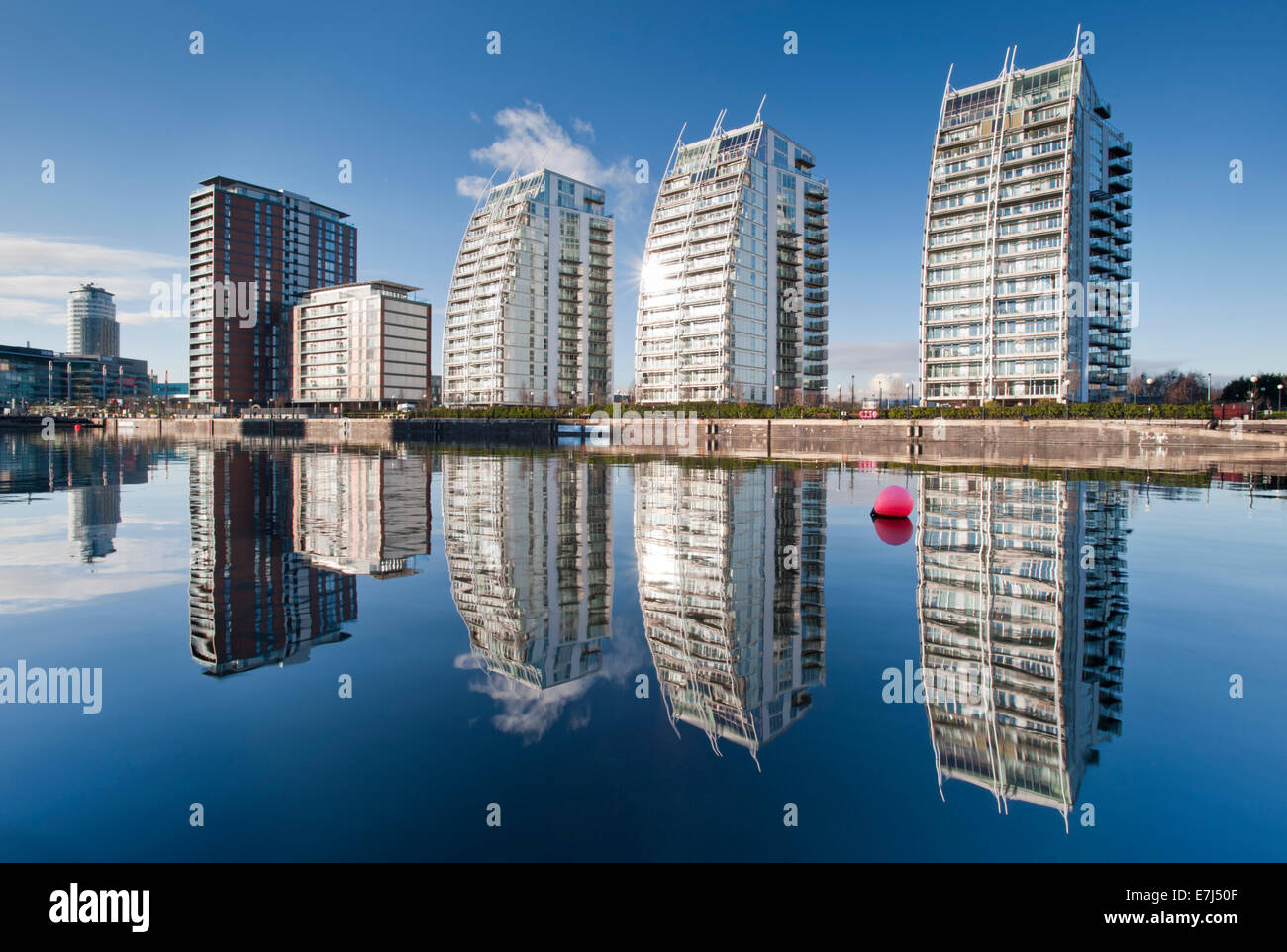 The NV Apartments Viewed Across Huron Basin, Salford Quays, Greater Manchester Stock Photo
