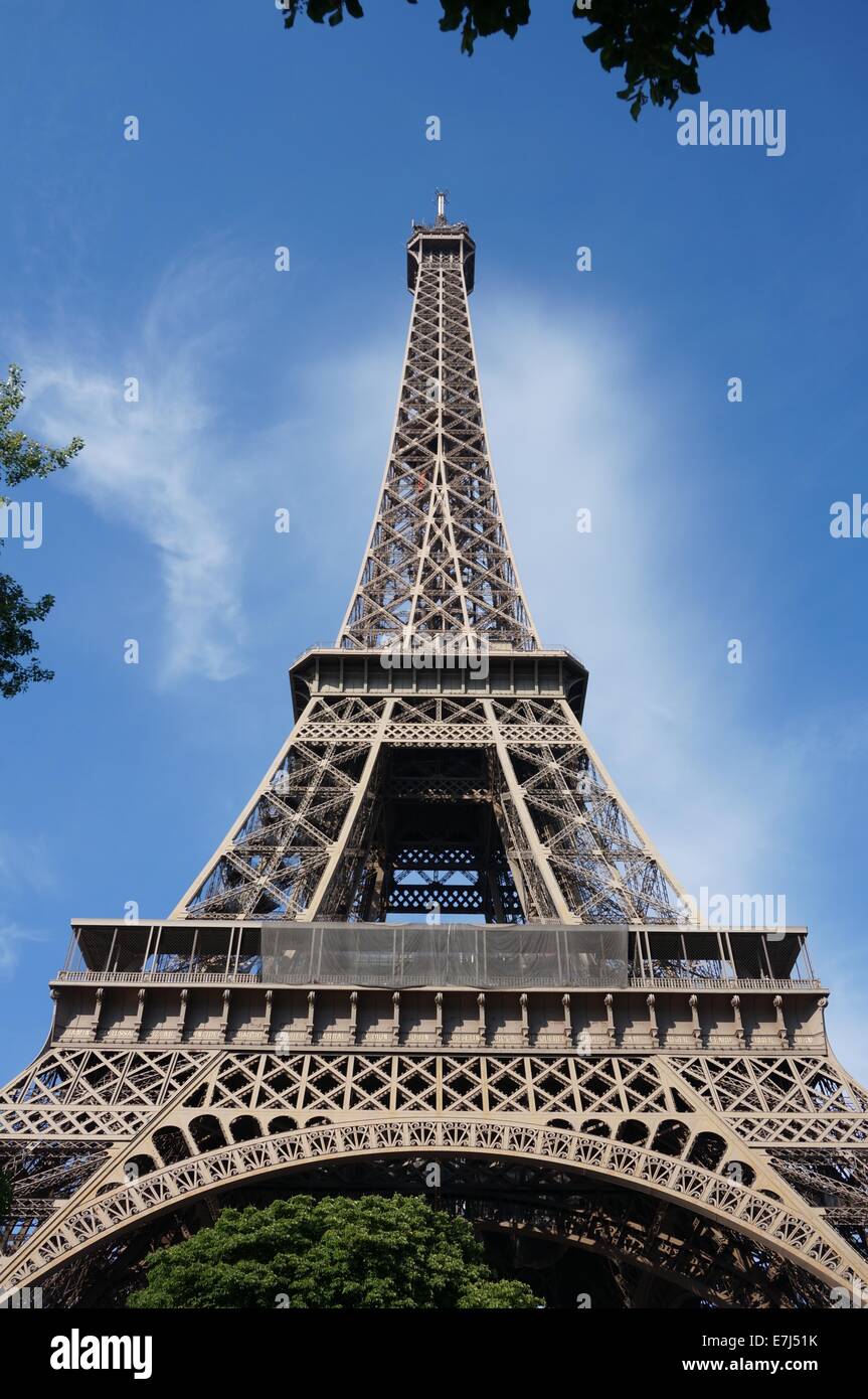 Eiffel Tower With Summer Green Trees Against A Blue Sky Stock Photo - Alamy