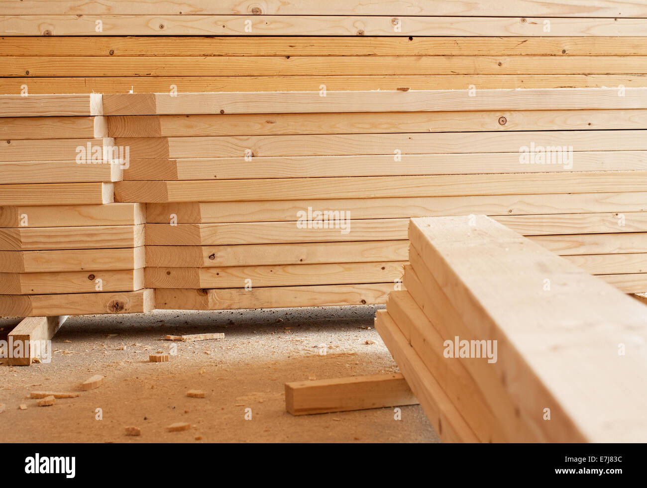 Stack of wooden planks inside workshop Stock Photo