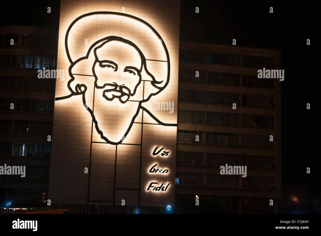 Illuminated steel sculpture of Fidel Castro on side of building in Havana. Stock Photo