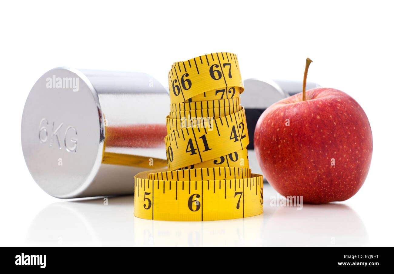 Gym Dumbbells with an Apple and tape measure Stock Photo
