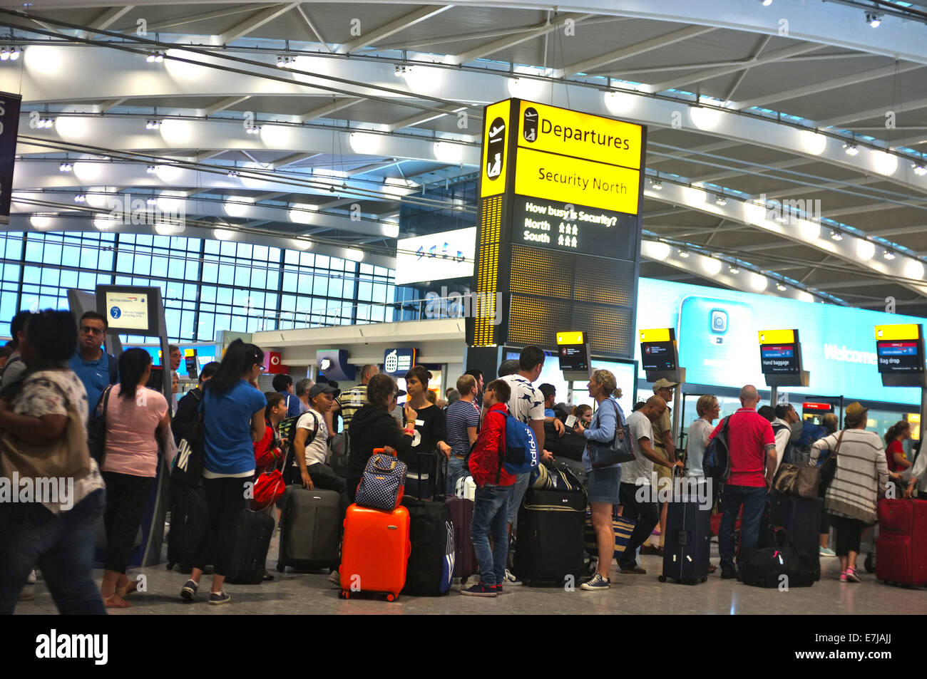 Travelers queuing at the airport Stock Photo