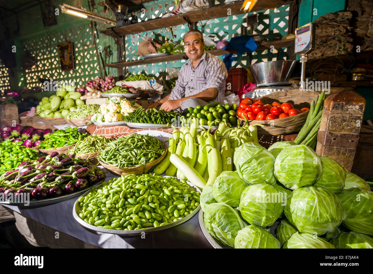 Man selling vegetables at a vegetable market, Bhavnagar, Gujarat, India Stock Photo